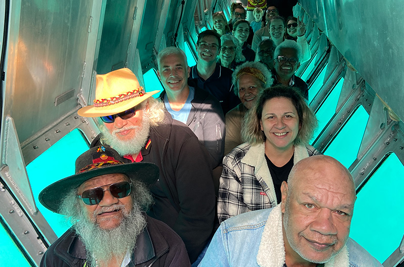 people in semi-submersible, glass-bottom boat